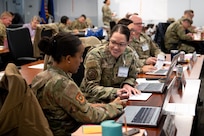 Image of Airmen and Guardians talking to each other.