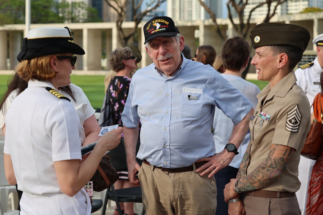U.S. Navy Capt. Meghan Bodnar, Defense POW/MIA Accounting Agency deputy director for operations, left, and U.S. Army Sgt. Major Lauren Flores, DPAA senior enlisted advisor, right, talk with Lee Blumenthal, Executive Director of the Jewish Association of the Philippines, a local veteran who attended the first-ever Repatriation Ceremony held at the Manila American Cemetery and Memorial in the Philippines, March 6, 2026. Currently, there are 71,783 U.S. personnel unaccounted for from World War II with approximately 10,000 missing in the Philippines, the largest total for any single country. (U.S. Air Force Photo by Lt. Col. George Tobias)