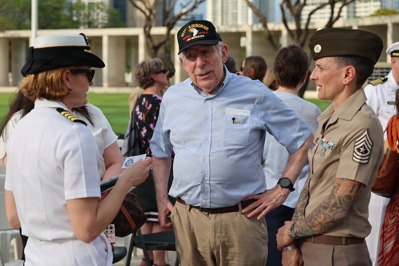 U.S. Navy Capt. Meghan Bodnar, Defense POW/MIA Accounting Agency deputy director for operations, left, and U.S. Army Sgt. Major Lauren Flores, DPAA senior enlisted advisor, right, talk with Lee Blumenthal, Executive Director of the Jewish Association of the Philippines, a local veteran who attended the first-ever Repatriation Ceremony held at the Manila American Cemetery and Memorial in the Philippines, March 6, 2026.