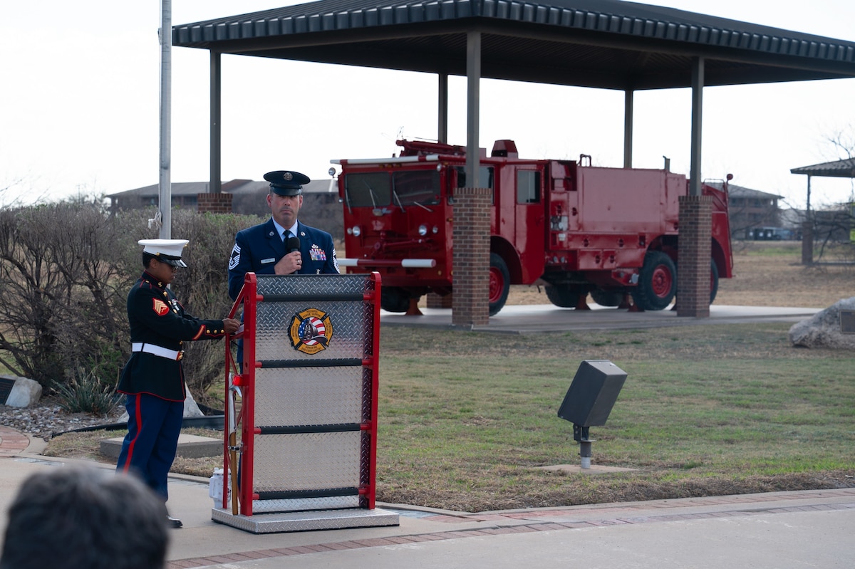 U.S. Air Force Chief Master Sgt. Michael Nalley, 312th Training Squadron senior enlisted leader, speaks at the annual Department of War Fallen Firefighter Memorial, Goodfellow Air Force Base, Texas, Mar. 6, 2026. Nalley spoke on the importance of each honoree added to the memorial and how they personified “Service before self” as firefighters. (U.S. Air Force photo by Senior Airman Brian Lummus)