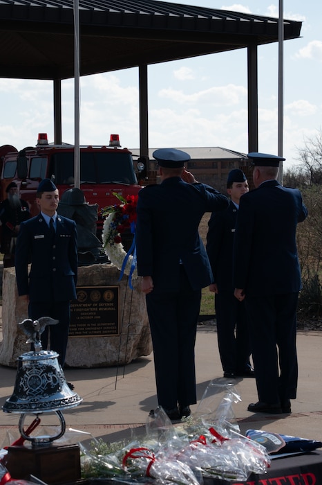 U.S. Air Force Col. Matthew Norton, 17th Training Wing commander, (right) and Lt. Col. Benjamin Shearer, 312th Training Squadron commander, (left) place the 2026 Remembrance Wreath at the annual Department of War Fallen Firefighter Memorial, Goodfellow Air Force Base, Texas, Mar. 6. Every year, Goodfellow places a wreath to honor the Department of War firefighters who have paid the ultimate sacrifice in the line of duty since 1941. (U.S. Air Force photo by Senior Airman Brian Lummus)