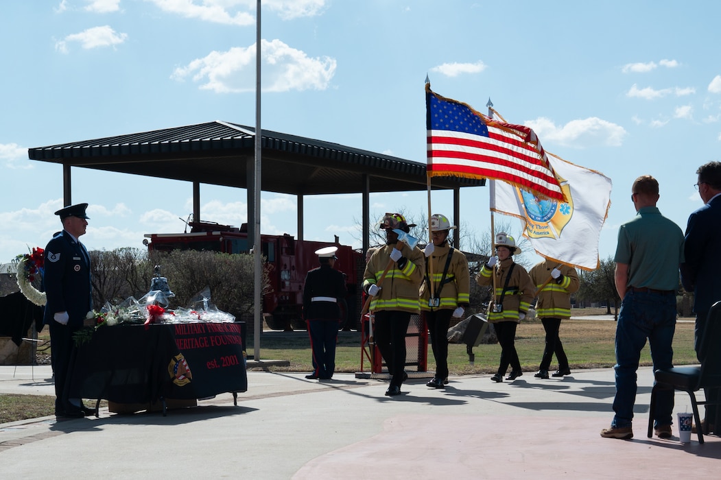 Members from the Louis F. Garland Fire Academy Joint Service Fire Guard present the Colors during the opening of the DoW Fallen Firefighter Memorial, Goodfellow Air Force Base, Texas, Mar. 6, 2026. The Fire Guard presented the colors, lowered the U.S. and Military Firefighter Heritage Foundation flags to half-staff and placed roses at the memorial site. (U.S. Air Force photo by Senior Airman Brian Lummus)