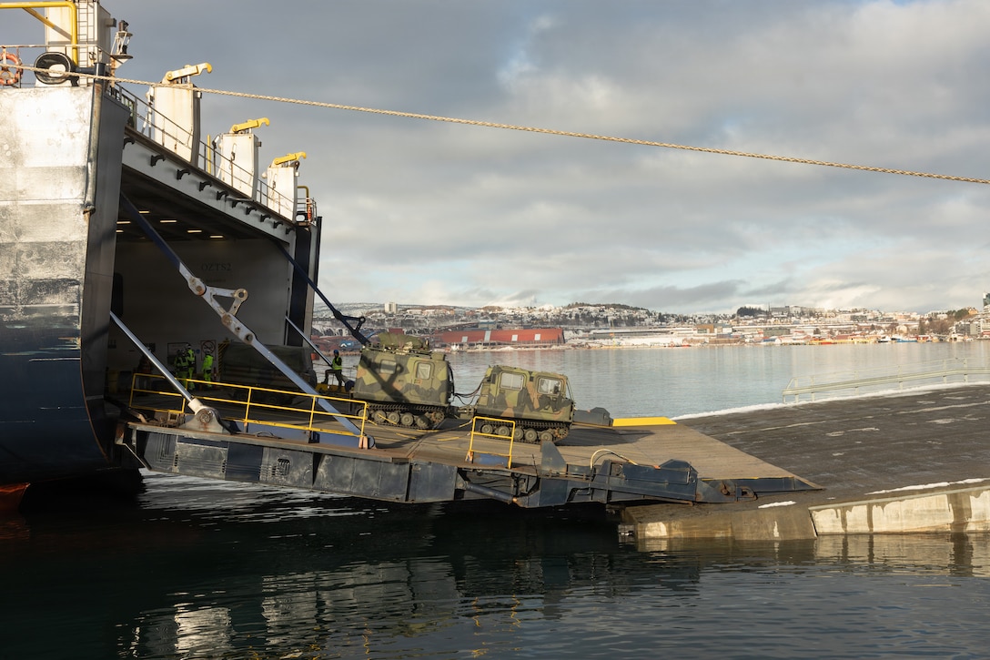 Norwegian soldiers with the Norwegian Defense Logistics Organization unload a Bandvagn 206 from the roll-on/roll-off cargo ship Britannia Seaways in Narvik, Norway, March 2, 2026. This was part of the Reception, Staging, and Onward Movement (RSOM) for exercise Cold Response 26, which is the process of rapidly assembling personnel and equipment into mission-ready forces. A key component of NATO's enhanced vigilance activity Arctic Sentry, exercise Cold Response 26 is a Norwegian-led winter military exercise designed to enhance collective defense capabilities and ensure U.S. readiness to rapidly deploy and seamlessly operate alongside NATO Allies in challenging arctic conditions. (U.S. Marine Corps photo by Lance Cpl. Franco Lewis)