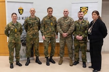 Norwegian army Chief of Defence Gen. Eirik Kristoffersen, center left, poses for a photo with the briefing staff of the Combined Joint Logistics Support Group during a tour of the CJLSG prior to exercise Cold Response 26 in Kjeller, Norway, Feb. 23, 2026. A key component of NATO's enhanced vigilance activity Arctic Sentry, exercise Cold Response 26 is a Norwegian-led winter military exercise designed to enhance collective defense capabilities and ensure U.S. readiness to rapidly deploy and seamlessly operate alongside NATO Allies in challenging arctic conditions. (U.S. Marine Corps photo by Sgt. Rafael Brambila-Pelayo)