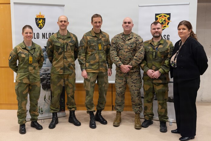 Norwegian army Chief of Defence Gen. Eirik Kristoffersen, center left, poses for a photo with the briefing staff of the Combined Joint Logistics Support Group during a tour of the CJLSG prior to exercise Cold Response 26 in Kjeller, Norway, Feb. 23, 2026. A key component of NATO's enhanced vigilance activity Arctic Sentry, exercise Cold Response 26 is a Norwegian-led winter military exercise designed to enhance collective defense capabilities and ensure U.S. readiness to rapidly deploy and seamlessly operate alongside NATO Allies in challenging arctic conditions. (U.S. Marine Corps photo by Sgt. Rafael Brambila-Pelayo)