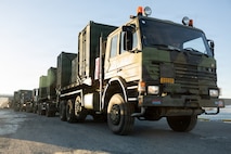 Norwegian tactical vehicles assigned to Combat Service Support Battalion, Norwegian Defense Logistics Organization, are staged during port operations in preparation for exercise Cold Response 26 in Verdalsora, Norway, Jan. 29, 2026. Exercise Cold Response 26 is a Norwegian-led winter military exercise designed to enhance collective defense capabilities and ensure U.S. readiness to rapidly deploy and seamlessly operate alongside NATO Allies in challenging Arctic conditions. (U.S. Marine Corps photo by Lance Cpl. Franco Lewis)