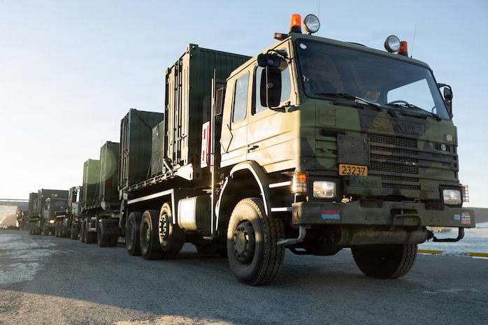 Norwegian tactical vehicles assigned to Combat Service Support Battalion, Norwegian Defense Logistics Organization, are staged during port operations in preparation for exercise Cold Response 26 in Verdalsora, Norway, Jan. 29, 2026. Exercise Cold Response 26 is a Norwegian-led winter military exercise designed to enhance collective defense capabilities and ensure U.S. readiness to rapidly deploy and seamlessly operate alongside NATO Allies in challenging Arctic conditions. (U.S. Marine Corps photo by Lance Cpl. Franco Lewis)