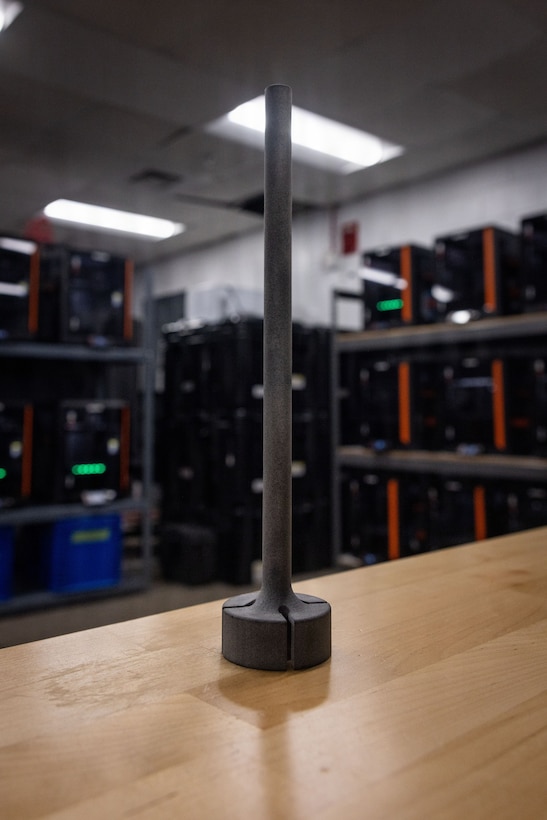 A Mobile User Object System antenna replacement mast, created by U.S. Marine Corps Lance Cpl. Eirick Schule, an engineer equipment operator with 2nd Distribution Support Battalion, Combat Logistics Regiment 2, 2nd Marine Logistics Group, is staged at the II Marine Expeditionary Force Innovation Campus on Marine Corps Base Camp Lejeune, North Carolina, Feb. 12, 2026. Currently assigned to the II MEF Innovation Campus, Schule designed and developed a replacement mast for the MOUS antenna in late April 2025, a solution that saved the Marine Corps thousands of dollars and increased the longevity of the equipment by allowing Marines to have a constant stream of reusable replacement pieces. (U.S. Marine Corps photo by Staff Sgt. Makayla Elizalde)
