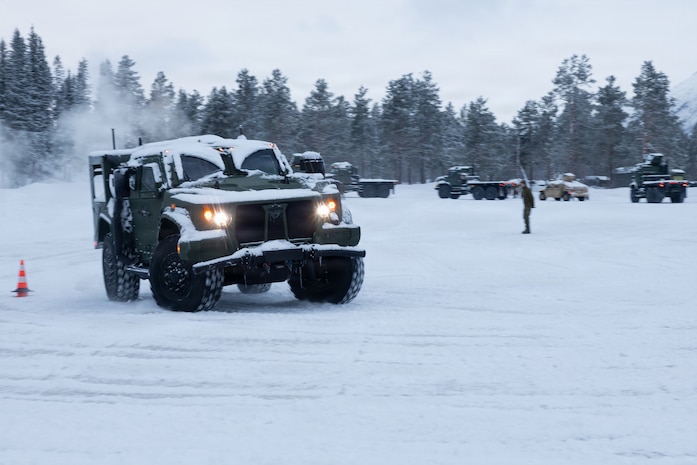 A U.S. Marine with Combat Logistics Battalion 6, Combat Logistics Regiment 2, 2nd Marine Logistics Group, drives a Joint Light Tactical Vehicle during a slippery driver training course in Setermoen, Norway, Jan. 26, 2026. This Norwegian-led course provides drivers with essential techniques for operating tactical vehicles safely in icy and snowy conditions. Exercise Cold Response 26 is a Norwegian-led winter military exercise designed to enhance collective defense capabilities and ensure U.S. readiness to rapidly deploy and seamlessly operate alongside NATO Allies in challenging arctic conditions. (U.S. Marine Corps photo by Cpl. Apollo Wilson)