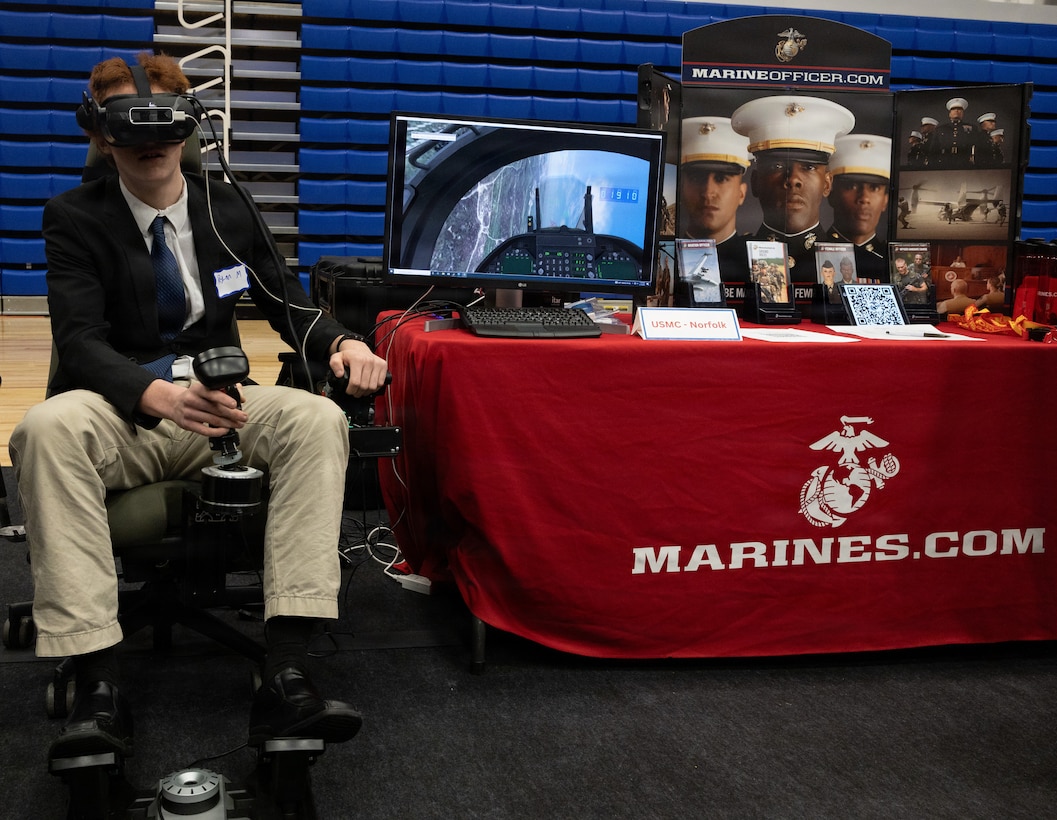 A student attending Elizabeth City State University experiences the flight simulator at the Elizabeth City State University Spring Career Fair in Elizabeth City, Va., Feb. 10, 2026. Marines attend career fairs such as this one to engage with the student body in an environment that encourages them to ask questions and gather information to make the best decision they can for their future. (U.S. Marine Corps photo by Cpl. Trion D. Jenkins)