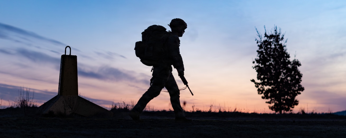 Pfc. Jesus Badillo-Rendon, a military police officer assigned to the 529th Military Police Company, leads from the front during the 12-mile ruck march of the 18th Military Police Brigade Best Squad Competition