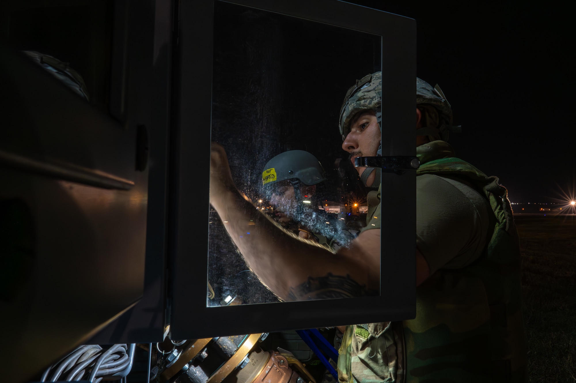 person works on refueling unit