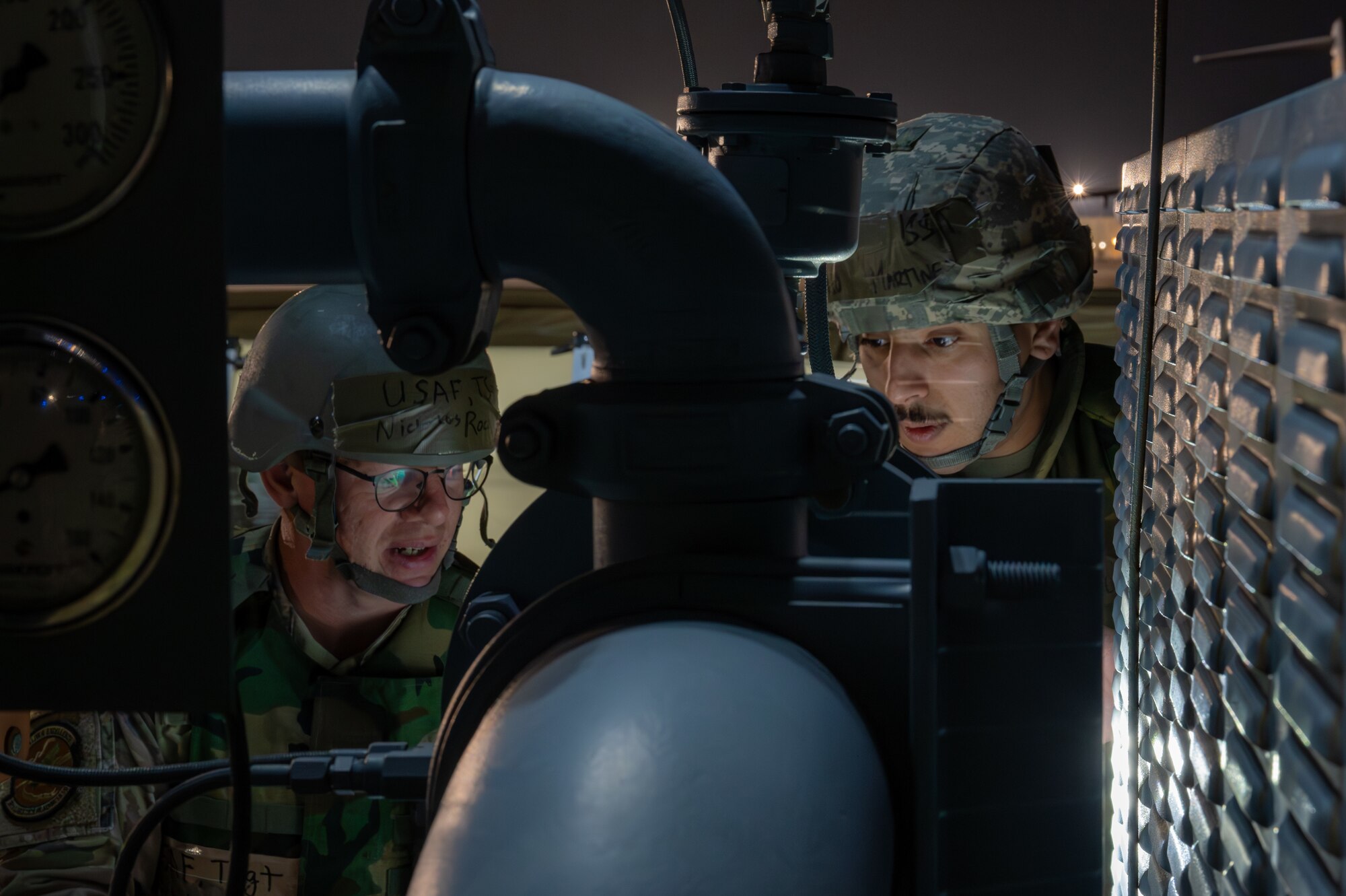 two people look at refueling unit
