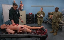 U.S. Air Force Col. Gregory Coleman (right), Air Force Global Strike Command surgeon general, observes medical training during a base visit at Minot Air Force Base, North Dakota, Feb. 25, 2026. As surgeon general, Coleman directs the strategy, policy, training, manpower, and resources for medical treatment facilities across Air Force Global Strike Command. (U.S. Air Force photo by Senior Airman Kyle Wilson)