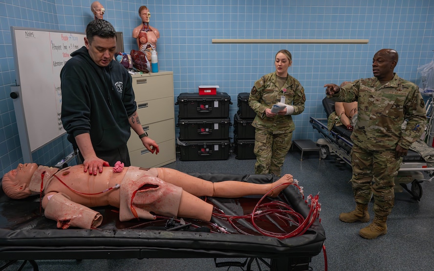 U.S. Air Force Col. Gregory Coleman (right), Air Force Global Strike Command surgeon general, observes medical training during a base visit at Minot Air Force Base, North Dakota, Feb. 25, 2026. As surgeon general, Coleman directs the strategy, policy, training, manpower, and resources for medical treatment facilities across Air Force Global Strike Command. (U.S. Air Force photo by Senior Airman Kyle Wilson)