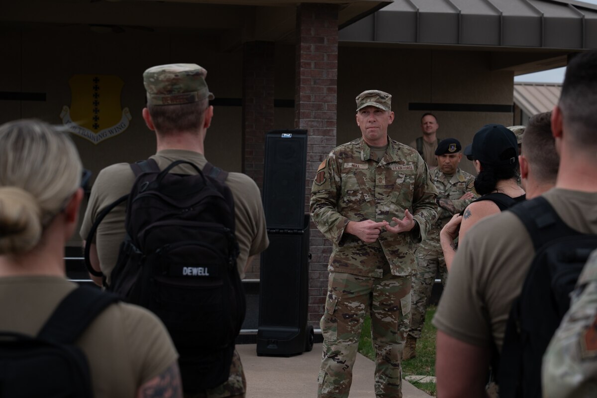 Chief Master Sgt. Derek Neill, 17th Training Wing command chief, gave opening remarks before the inaugural Noncommissioned Officer Ruck March at Goodfellow Air Force Base, Texas, March 5, 2026. Neill spoke on the roles and responsibilities NCOs have in developing junior Airmen in today’s Air Force. (U.S. Air Force photo by Senior Airman Brian Lummus)
