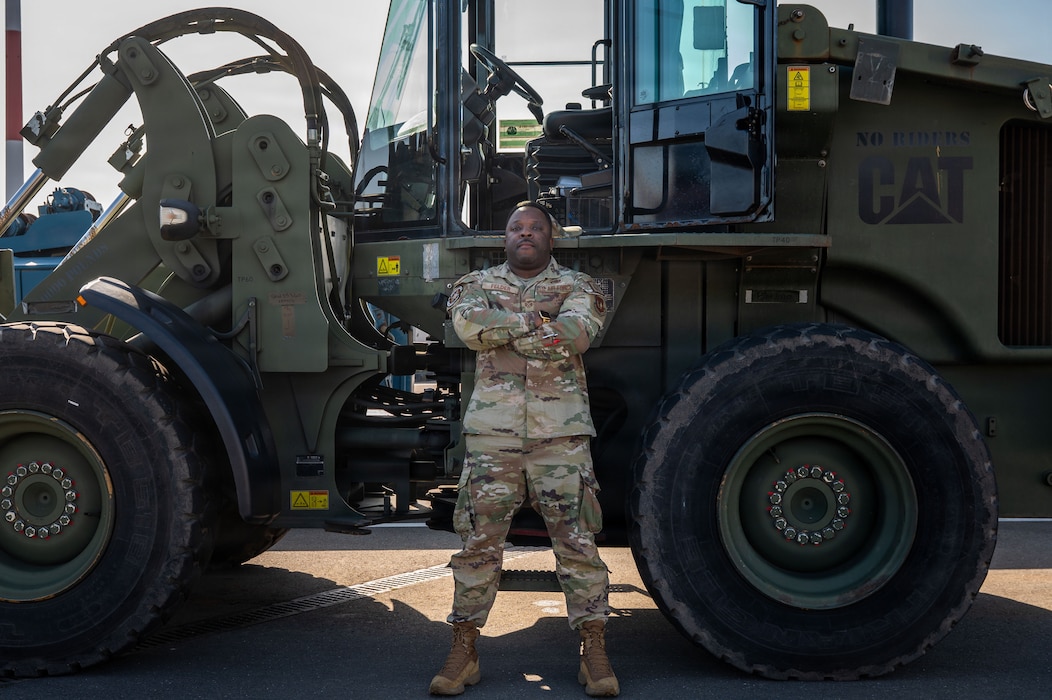 U.S. Air Force Staff Sgt. Jeffrey Felder, 86th Vehicle Readiness Squadron validation and operations supervisor, poses in front of an all-terrain forklift at Ramstein Air Base, Germany, Feb. 27, 2026. Felder manages career development courses, certifications to road permits, heavy vehicle qualifications and readiness requirements for VRS Airmen. (U.S. Air Force photo by Airman 1st Class Joseph Curzi)