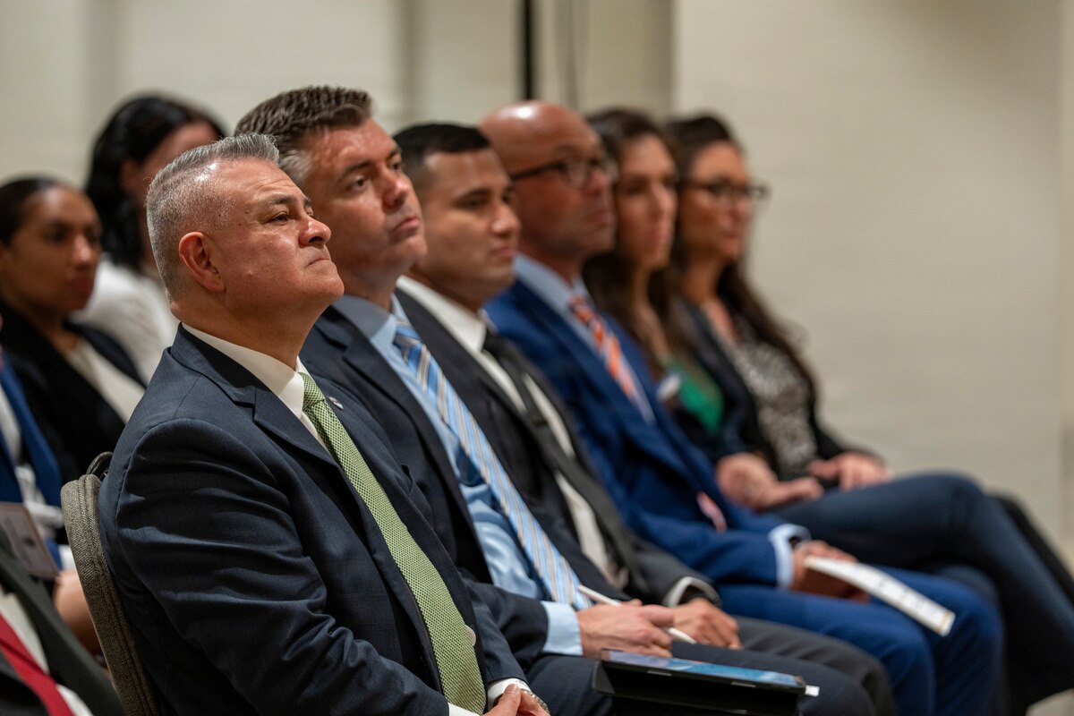 U.S. Army National Guard Maj. Gen. Javier Reina, left, deputy commander for mobilization and reserve affairs at U.S. Southern Command, and attendees listen to remarks during the Lesser Antilles Medical Assistance Team (LAMAT) 2026 closing ceremony in Frigate Bay, Saint Kitts and Nevis, March 6, 2026. The ceremony marked the conclusion of a two-week medical engagement that brought U.S. Air Force personnel and Ministry of Health providers together across St. Kitts and Nevis.  (U.S. Air Force photo by Andrea Jenkins)