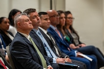 U.S. Army National Guard Maj. Gen. Javier Reina, left, deputy commander for mobilization and reserve affairs at U.S. Southern Command, and attendees listen to remarks during the Lesser Antilles Medical Assistance Team (LAMAT) 2026 closing ceremony in Frigate Bay, Saint Kitts and Nevis, March 6, 2026. The ceremony marked the conclusion of a two-week medical engagement that brought U.S. Air Force personnel and Ministry of Health providers together across St. Kitts and Nevis.  (U.S. Air Force photo by Andrea Jenkins)