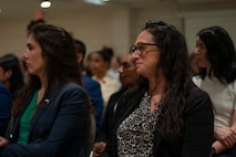 U.S. Air Force Reserve Lt. Col Emily De Leon, right, listens to remarks during the Lesser Antilles Medical Assistance Team (LAMAT) 2026 closing ceremony in Frigate Bay, Saint Kitts and Nevis, March 7, 2026. The ceremony marked the conclusion of a two-week medical engagement that brought U.S. Air Force personnel and Ministry of Health providers together across St. Kitts and Nevis. (U.S. Air Force photo by Andrea Jenkins)
