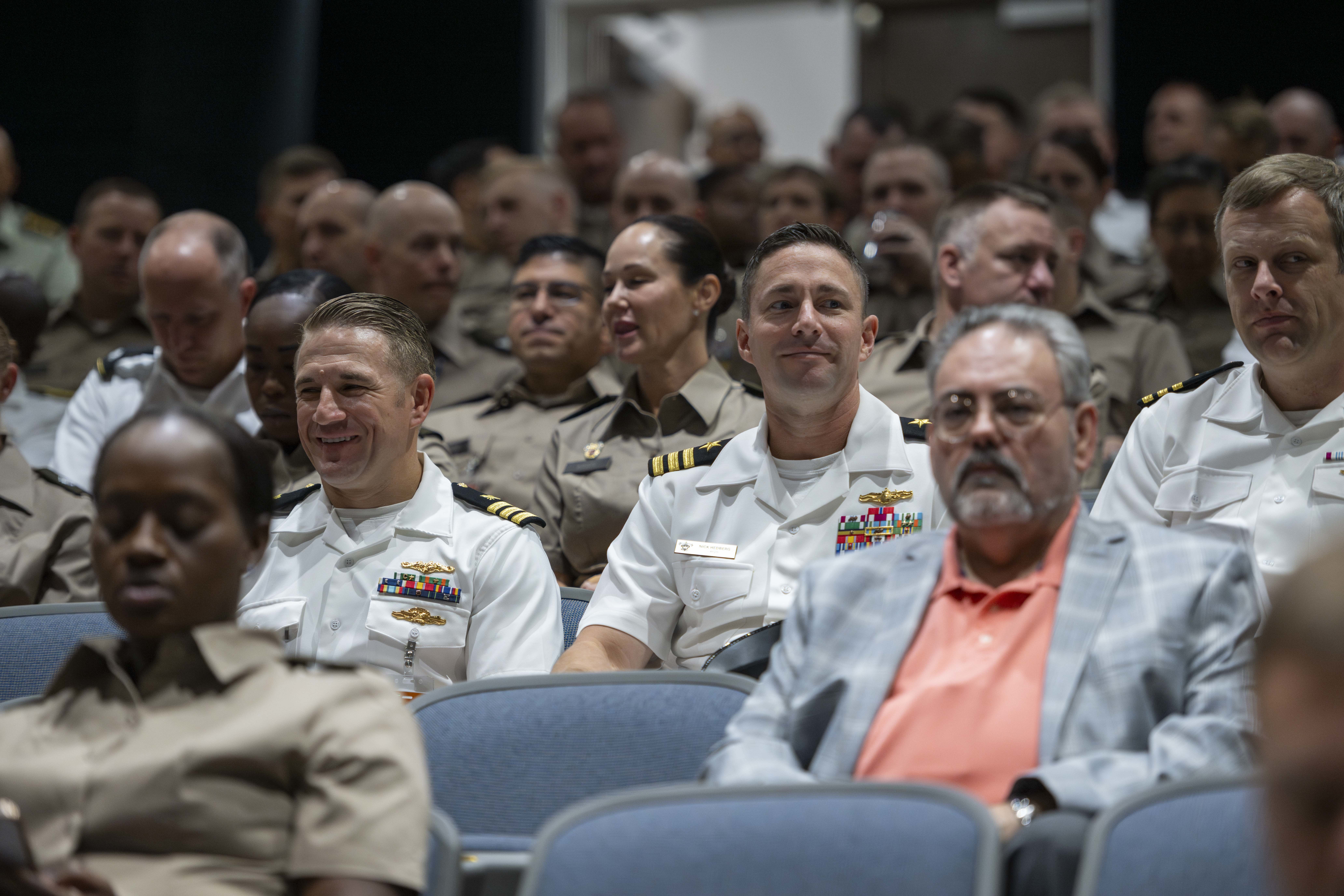 Students in the crowd of Bliss Auditorium wearing their services uniforms. 