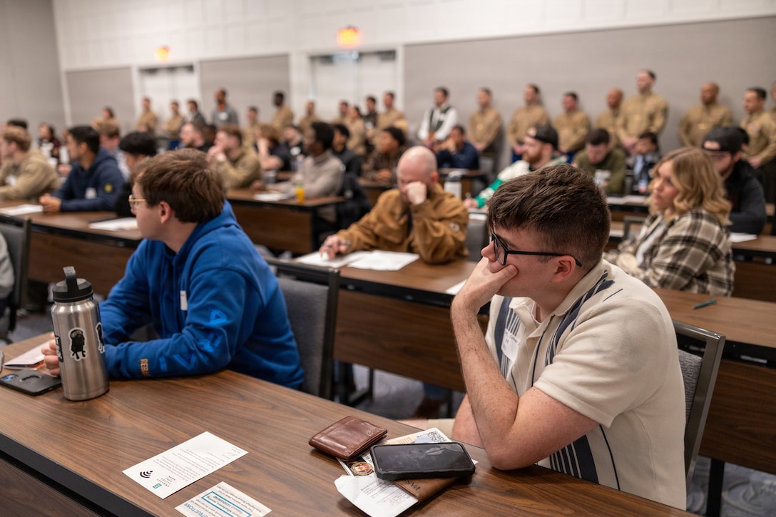 U.S. Marines with the Individual Ready Reserve listen to Honorable Hung Cao, the undersecretary of the Navy, during the Individual Ready Reserve muster at Arlington, Virginia, March 7, 2026. Marine Corps Individual Reserve Support Activity conducts administrative screenings of IRR Marines to ensure readiness to augment and reinforce the active component. (U.S. Marine Corps photo by Sgt. Emely Gonzalez)