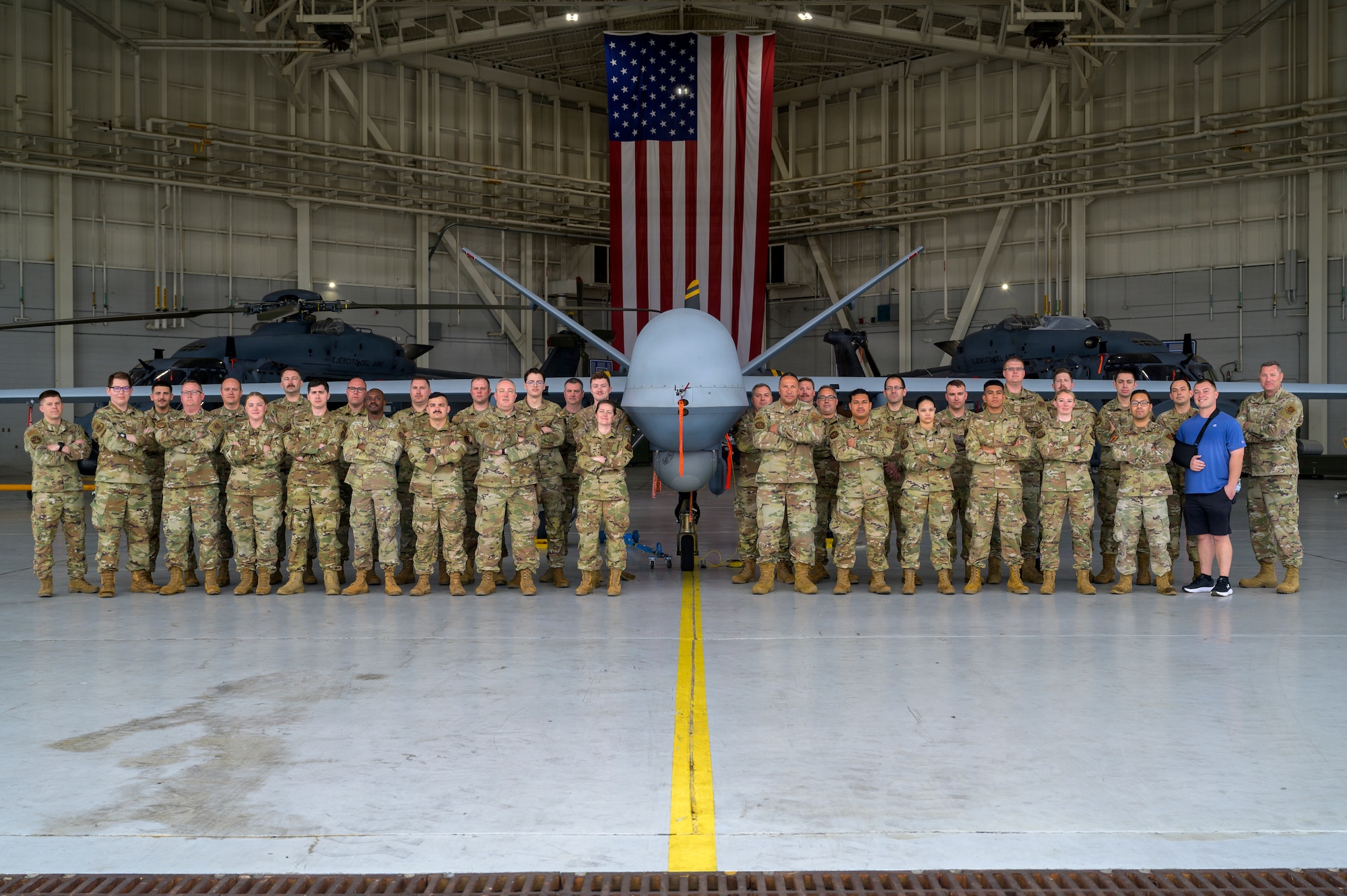 U.S. Air Force Airmen assigned to the 174th Attack Wing, New York Air National Guard, pose for a group photo during exercise Sentry South 26-2 in Gulfport, Mississippi, March 3, 2026. Sentry South 26-2 is a large force employment exercise focused on major combat operations and joint maritime opportunities in a contested or degraded operational environment. Sentry South 26-2 applies joint and combined warfighting doctrine against realistic and robust enemy integrated threat systems, all while under safe and controlled conditions. (U.S. Air National Guard photo by Staff Sgt. Dylan McCrink)