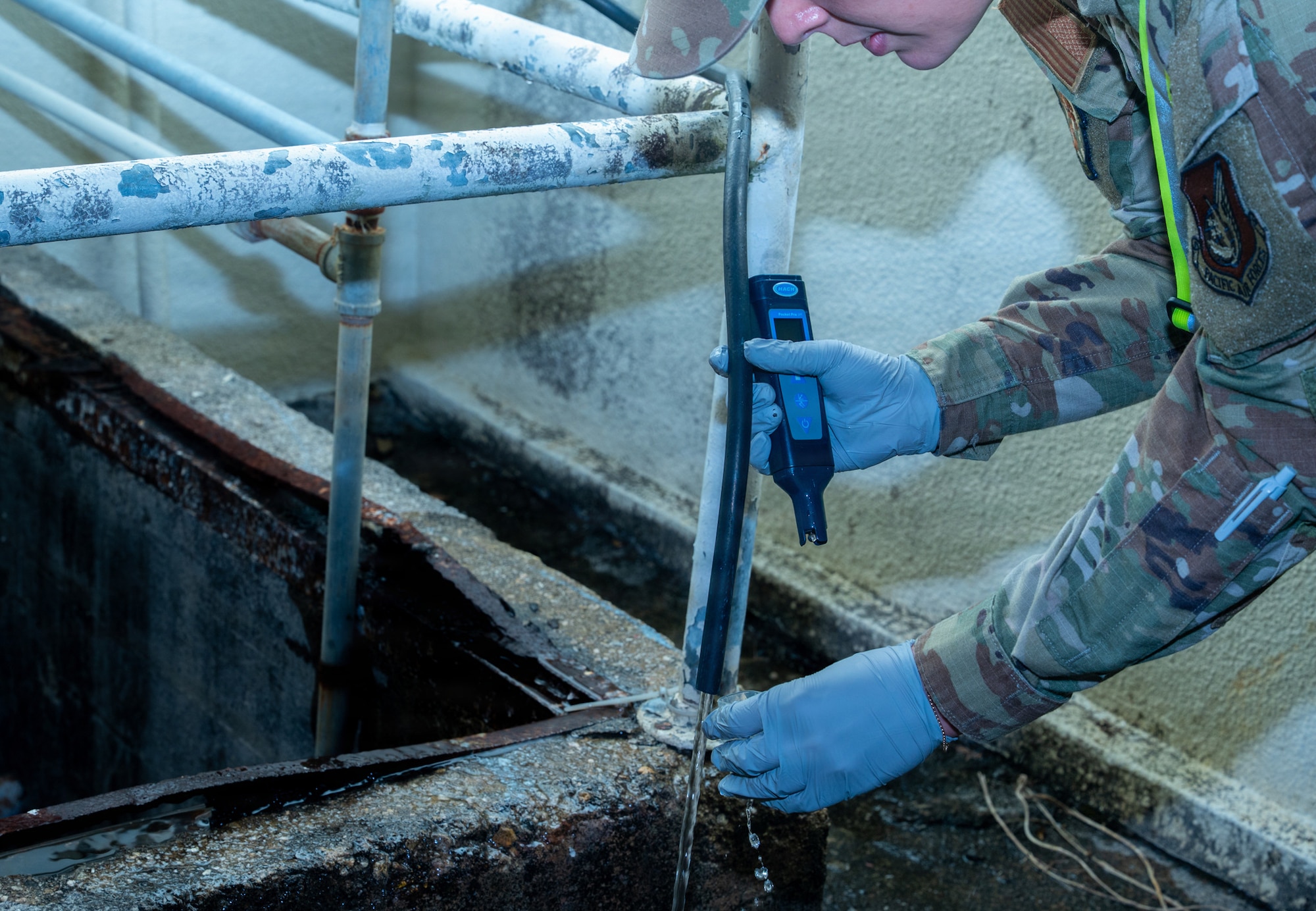Collecting water from a hose into a test tube
