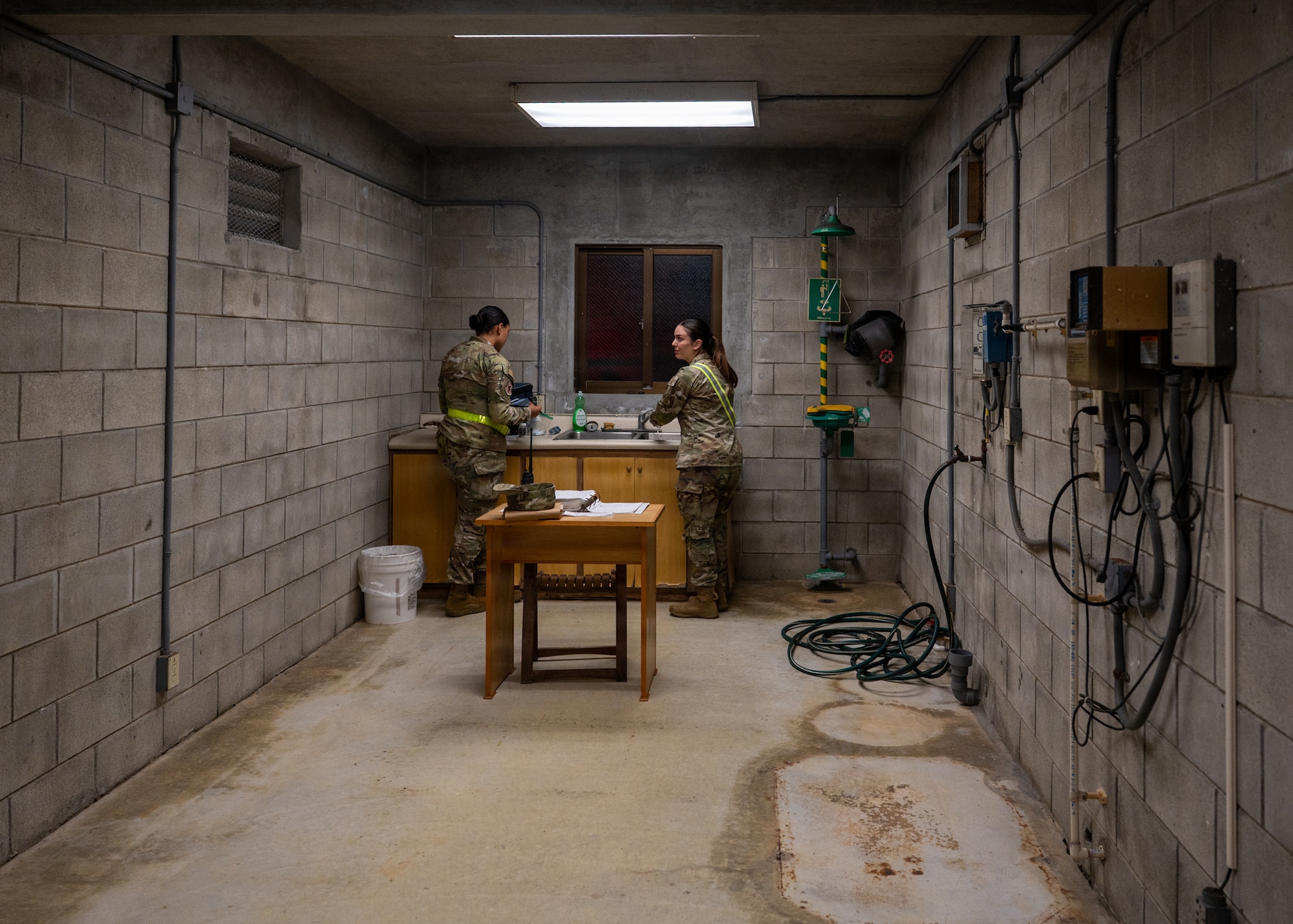 An empty rick room with nothing but a sink and a table