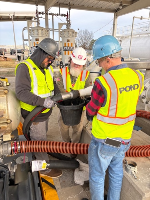Huntsville Center Fuels Program team member and contractors work on fuel piping repairs.