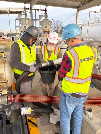 Huntsville Center Fuels Program team member and contractors work on fuel piping repairs.