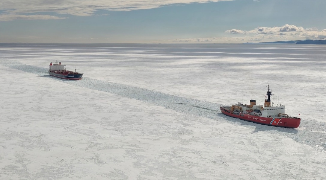 USCGC Polar Star escorts the motor vessel Stena Polaris, the largest fuel tanker ever to reach McMurdo Station, through the ice-covered Ross Sea during Operation Deep Freeze 2026, Jan. 21, 2026. Pacific Air Forces operates on a 24-hour basis to provide the U.S. National Science Foundation complete joint operational and logistic support for Operation Deep Freeze. (U.S. Coast Guard photo by Ensign Madelyn Greene)