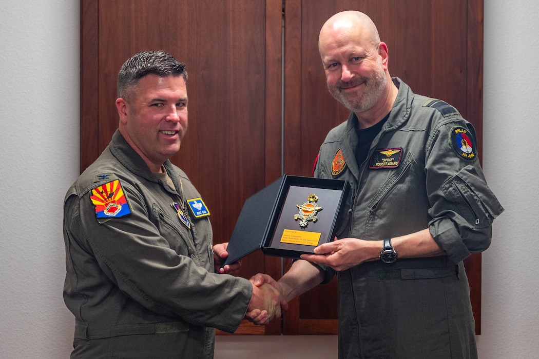 U.S. Air Force Col. John Ryan(left), 56th Fighter Wing deputy commander, and Royal Netherlands Air and Space Force Maj. Gen. Robert Adang (right), RNLAF deputy commander, pose for a photo, Mar. 3, 2026, at Luke Air Force Base, Arizona.