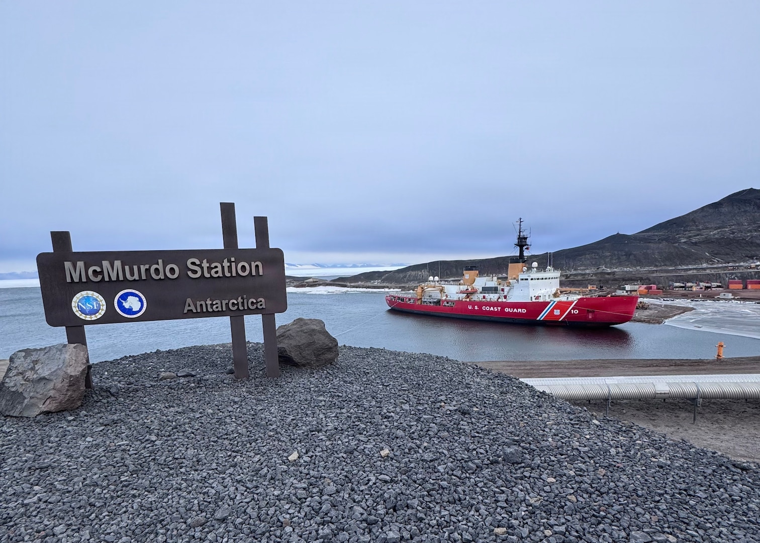 USCGC Polar Star (WAGB 10) sits moored at McMurdo Station Antarctica amid Operation Deep Freeze 2026, Feb. 2, 2026. Operation Deep Freeze is one of the more challenging U.S. military peacetime missions due to the harsh environment in which it is conducted, and this year also commemorates the Polar Star’s 50th year of service. (U.S. Coast Guard photo by Petty Officer 2nd Class Christopher Bokum)