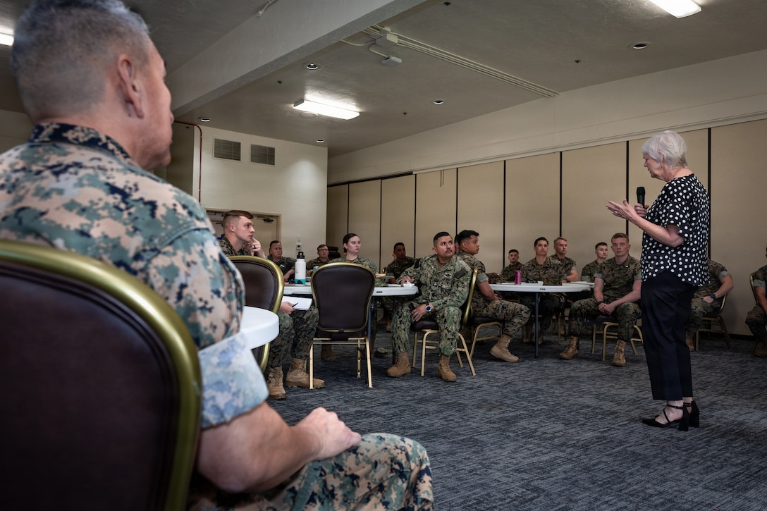Ms. Miranda, director of the Navy-Marine Corps Relief Society, Marine Corps Base Camp Pendleton, speaks to U.S. Marines and Sailors during the Active Duty Fund Drive at MCB Camp Pendleton, Calif., March 9, 2026. The fund drive raises donations to support Navy and Marine Corps personnel and their families experiencing financial hardship. (U.S. Marine Corps photo by Cpl. Paschal)