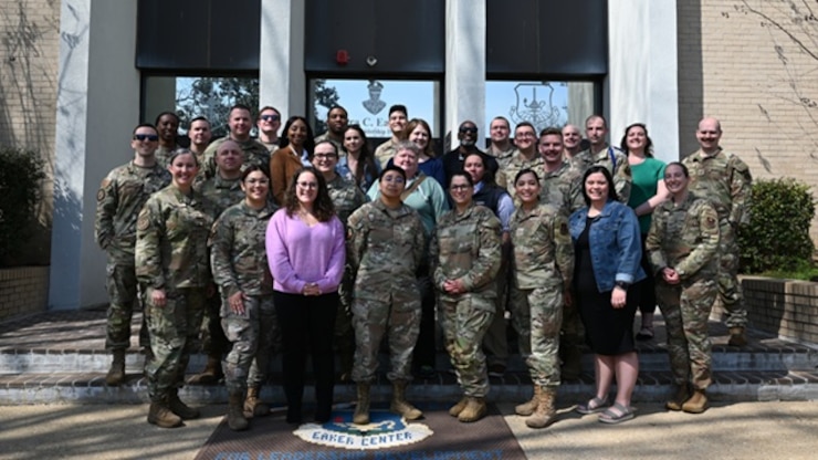 U.S. Airmen from the Force Support Professional Development School pose for a photo at Maxwell Air Force Base, Alabama, Feb. 26, 2025. U.S. Air Force Tech. Sgt. Kathleen McConnell, FSPDS master resilience trainer course instructor, bottom left, trains and develops other Airm