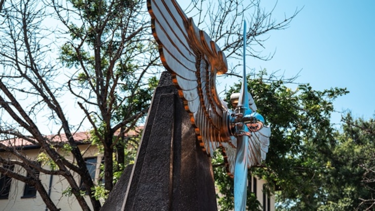 The Prop and Wings statue in front of the Air University headquarters at Maxwell Air Force Base, Alabama, June 3, 2025. The Prop and Wings is a symbol representing the American Airman. (U.S. Air Force photo by Senior Airman Evan Lichtenhan)