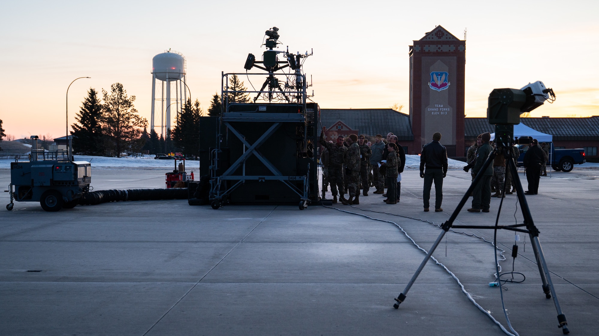 A photo of a flightline early in the morning.