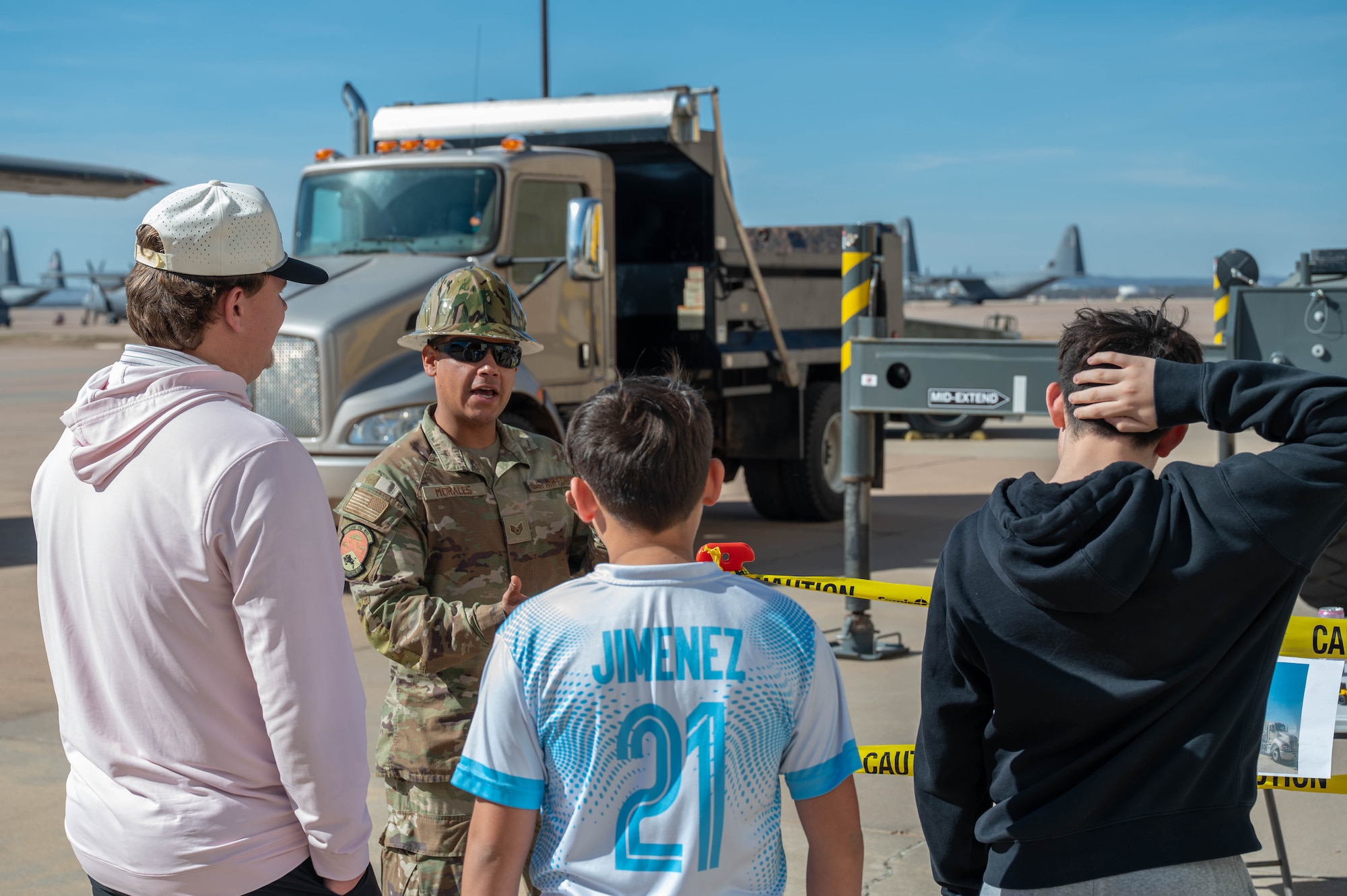 U.S. Air Force Staff Sgt. Steven Morales, 7th Civil Engineer Squadron heavy equipment supervisor, explains equipment and tools on display to students during a career fair at Dyess Air Force Base, Texas, Feb. 26, 2026. Morales provided insight into the skills and responsibilities required to maintain and repair base infrastructure. (U.S. Air Force photo by Airman 1st Class William Neal)