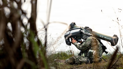 THAILAND (March 5, 2026) — Republic of Korea Marine Corps Sgt. Seungno Kim, a squad leader assigned to Firearms Company, 82nd Battalion, 8th Brigade, 2nd Marine Division, prepares to fire an AT-1K Raybolt during a combined arms live-fire range part of Exercise Cobra Gold 2026 at Ban Chan Khrem, Khao Khitchakut district, Thailand, March 5, 2026.