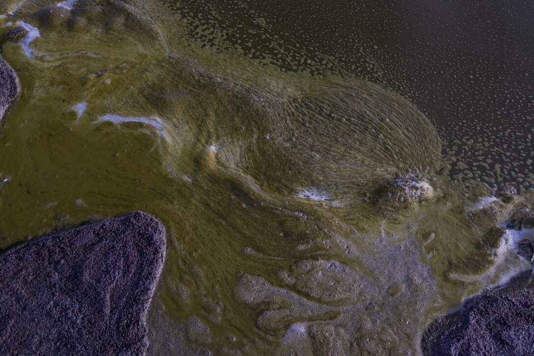 Polluted saline water washes along the shore of Bombay Beach Feb. 23 in the Salton Sea. The hypersaline waters of the lake are receding, exposing contaminated playa, which contributes to harmful dust storms and furthers the salinity of the body of water currently undergoing a mega study in collaboration with the U.S. Army Corps of Engineers and California state partner agencies to determine the best strategy to restore the water in the interests of the local community.