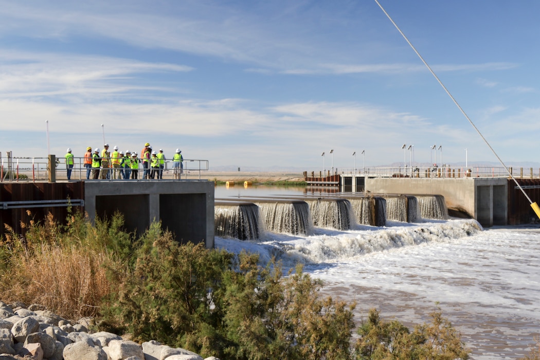 U.S. Army Corps of Engineers senior leaders, California state agency partners and contactors meet Feb. 24 to observe the New River inflow heading toward the Salton Sea Species Conservation Habitat. The inflow waters are aerated to encourage nutrient breakdown and mitigate harmful algal blooms before it flows into the constructed wetlands.
