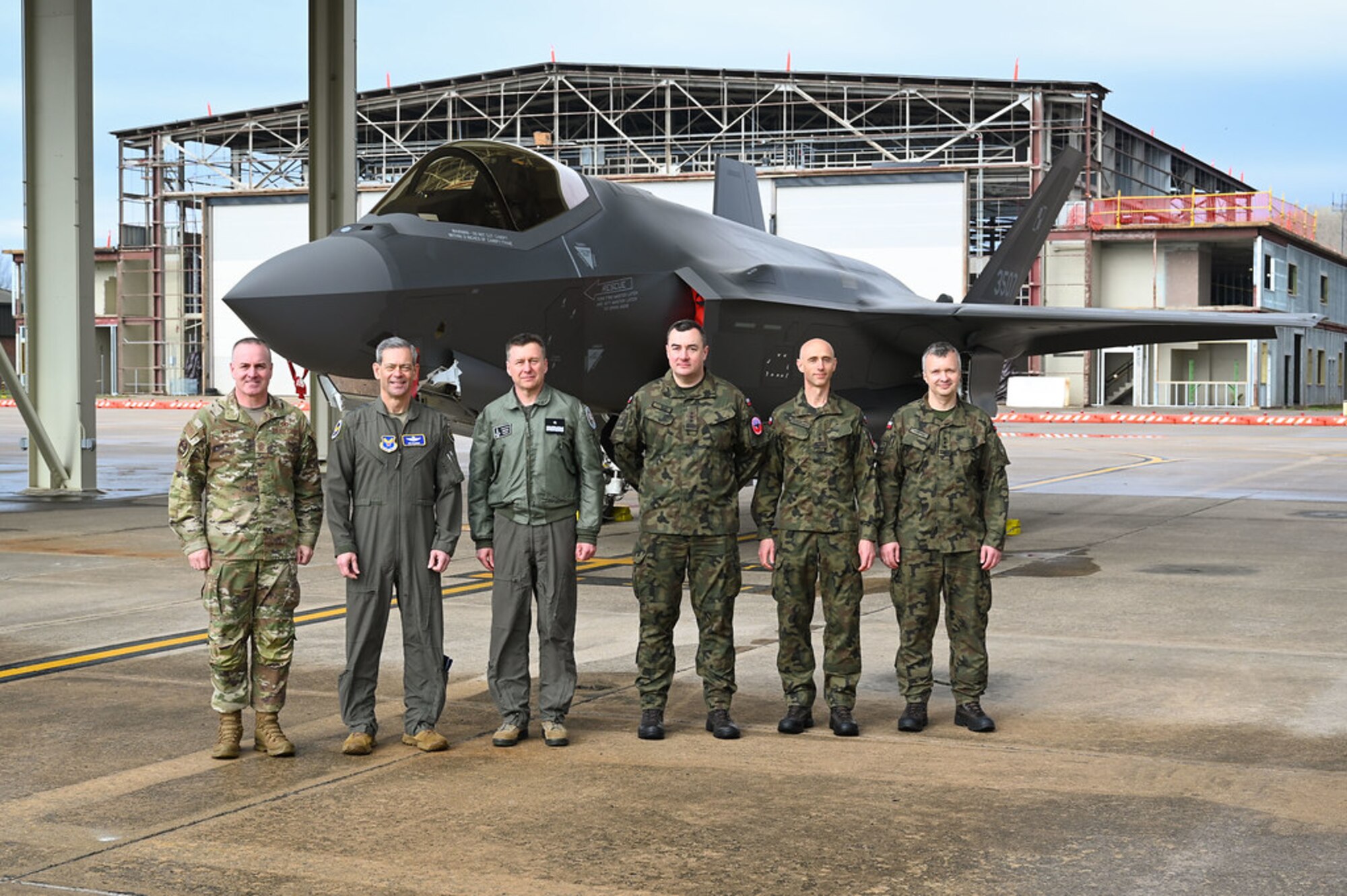 Air Force Chief of Staff Gen. Ken Wilsbach and Chief Master Sgt. of the Air Force David Wolfe pose for a group photo with leadership from the 188th Wing, 33rd Fighter Wing, and Polish Air Force at Ebbing Air National Guard Base, Ark., March 9, 2026.