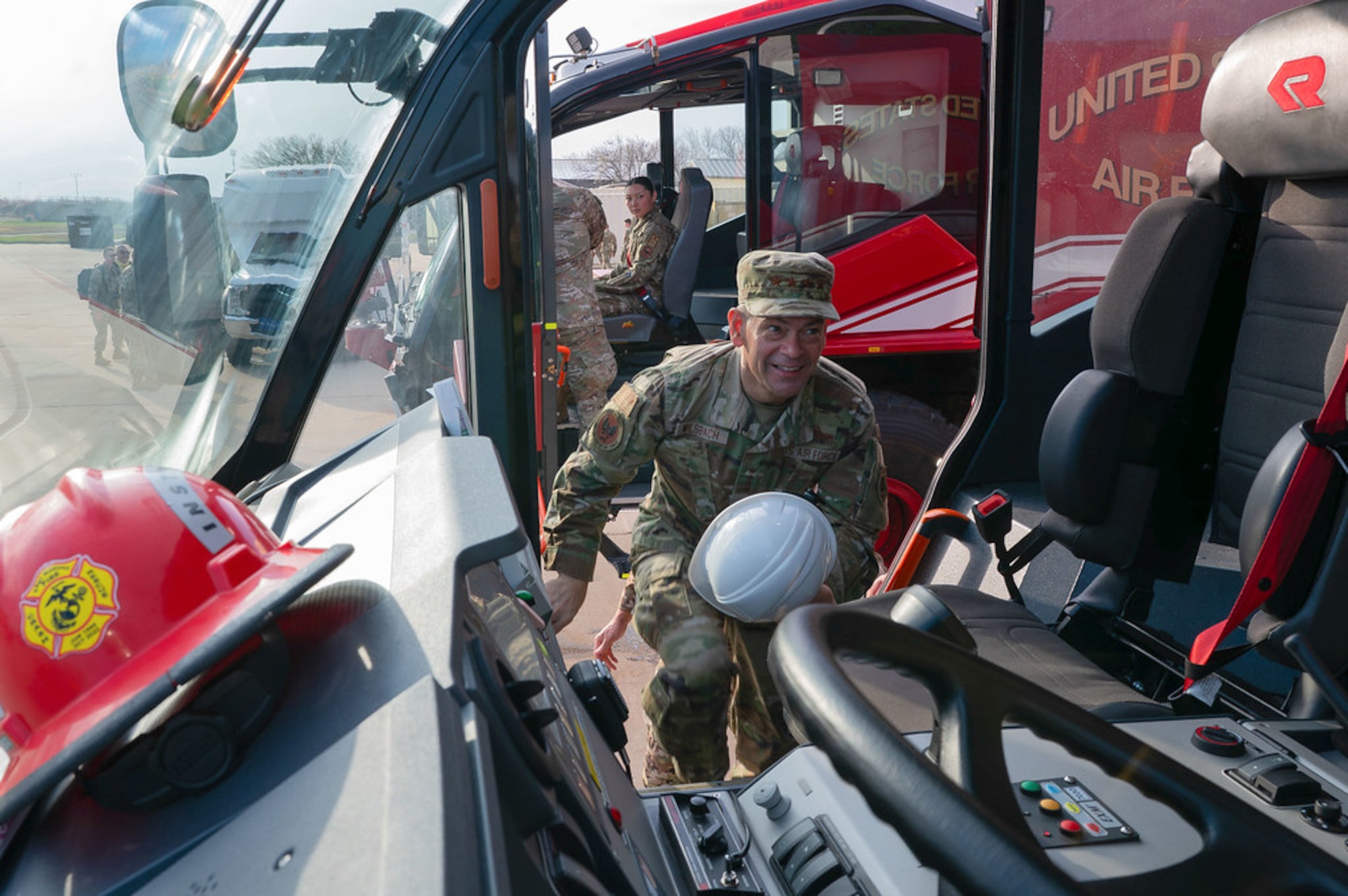 U.S. Air Force Chief of Staff Gen. Ken Wilsbach climbs into a Rosenbauer Panther fire truck at the Louis F. Garland Fire Academy, Goodfellow AFB, Texas, March 10, 2026.