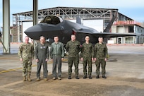 Air Force Chief of Staff Gen. Ken Wilsbach and Chief Master Sgt. of the Air Force David Wolfe pose for a group photo with leadership from the 188th Wing, 33rd Fighter Wing, and Polish Air Force at Ebbing Air National Guard Base, Ark., March 9, 2026.