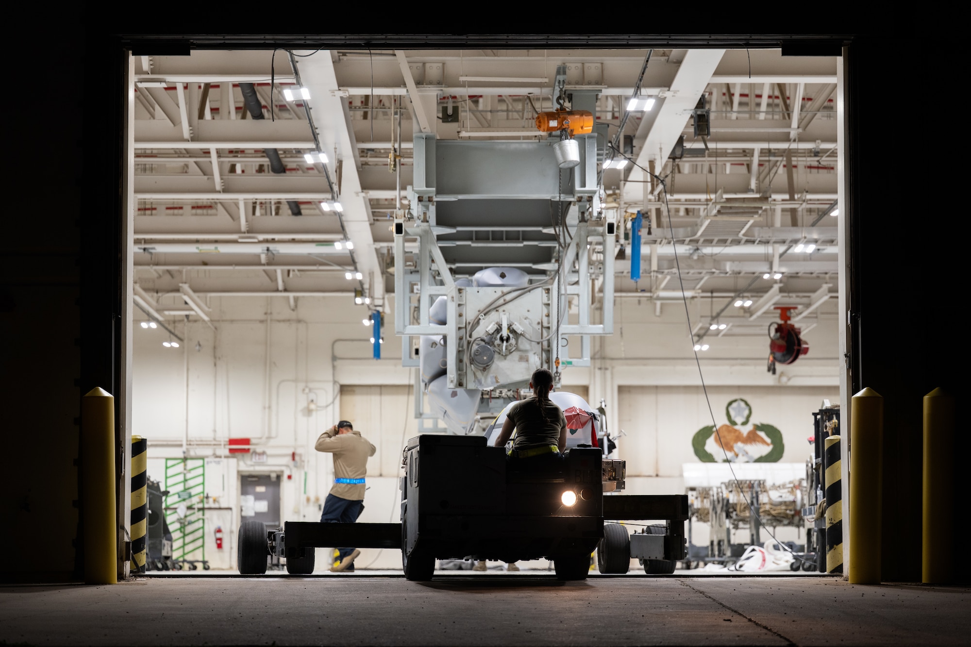 U.S. Air Force Staff Sgt. Heriberto Perez, 7th Munitions Squadron armament maintenance supervisor, left, and Airman 1st Class Maya Roberto, 7th MUNS armament maintenance member, prepare to position a Joint Air-to-Surface Standoff Missile to be loaded onto a B-1B Lancer at Dyess Air Force Base, Texas, Feb. 14, 2026. The JASSM weapon system enables the Air Force to strike targets from extended ranges, strengthening deterrence and global strike capabilities. (U.S. Air Force photo by Airman 1st Class Caleb Schellenberg)