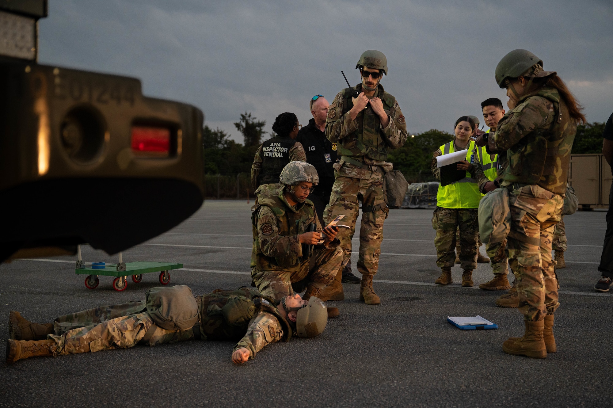 U.S. Air Force Airmen assigned to the 18th Logistics Readiness Squadron assess SrA Leonel Murillo, 18th Traffic Management Office technician, for vitals after he is simulated to have been crushed by a forklift during USAF-led operational exercise Beverly Midnight 26 at Kadena Air Base, Japan, Mar. 10, 2026. BM26 provides unique opportunities to synchronize and integrate various forces across Japan into joint, coalition and bilateral training from simulated forward operating bases. (U.S. Air Force photo by Senior Airman Jamal J. Berry II)