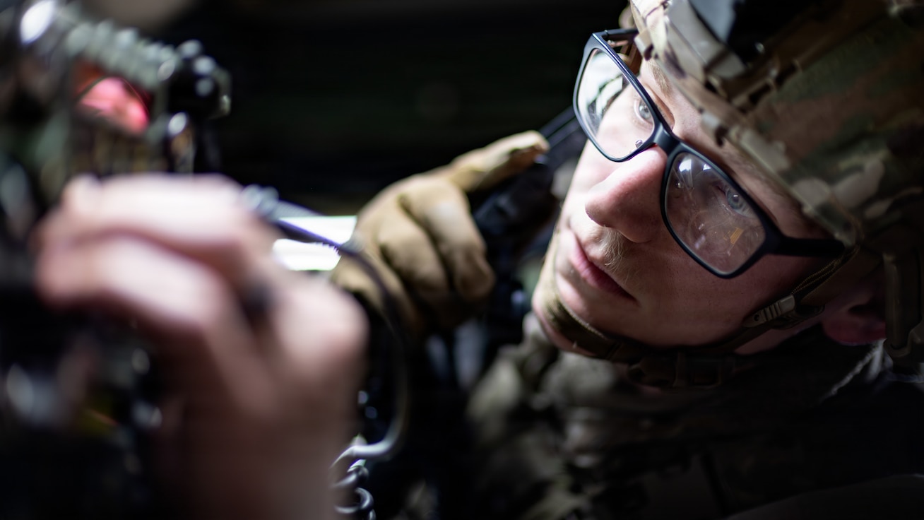 Sgt. Jacob Anderson, a military police officer assigned to the 615th Military Police Company, 709th, troubleshoots his radio during a mounted patrol as part of a field training exercise.
