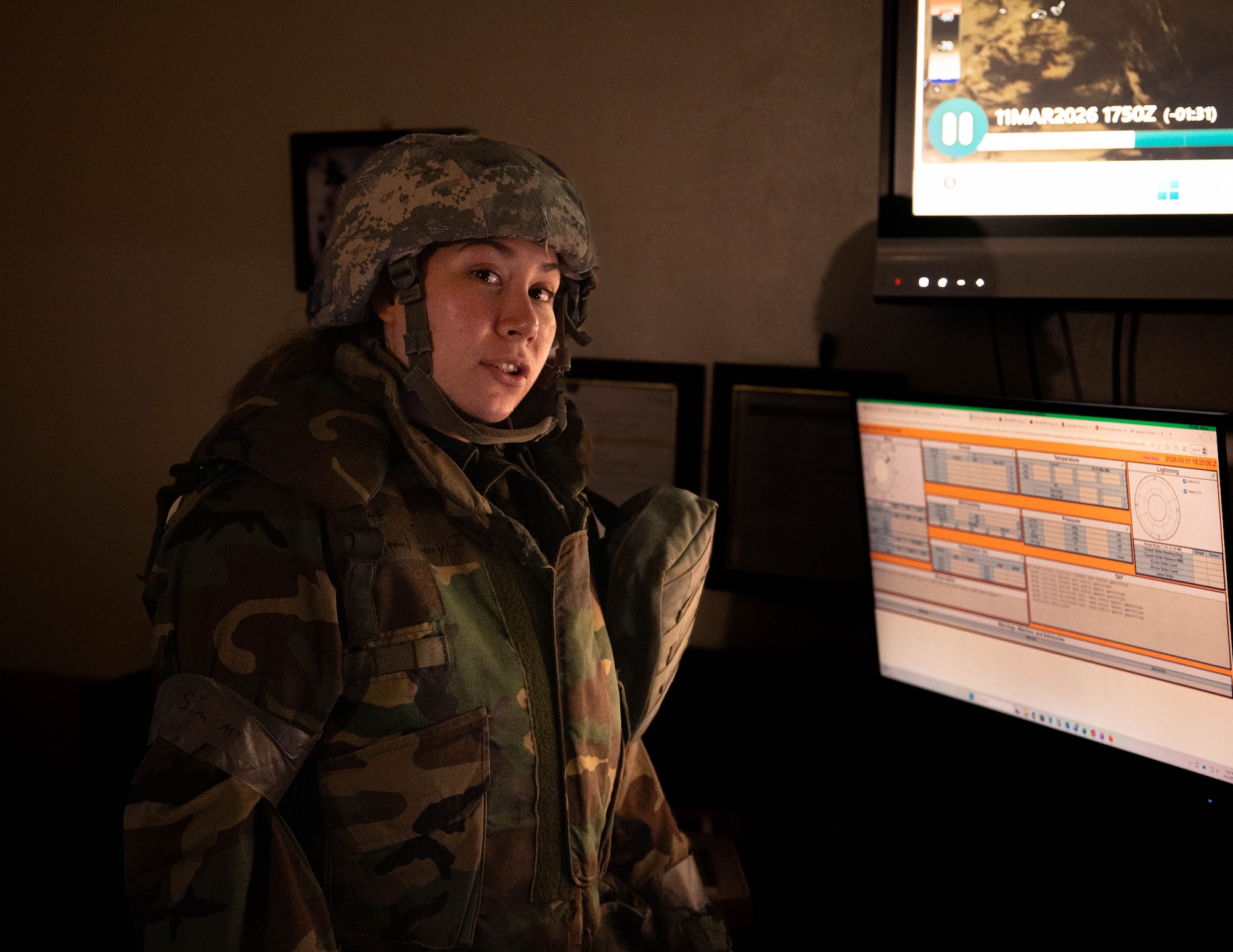 U.S. Air Force Senior Airman Vivian Ceniceros, 18th Operations Support Squadron weather forecaster, explains the weather forecast systems and maps during a USAF-led operational exercise Beverly Midnight 26 at Kadena Air Base, Japan, March 12, 2026. BM26 provides unique opportunities to synchronize and integrate various forces across Japan into joint, coalition and bilateral training from simulated forward operating bases. (U.S. Air Force photo by Senior Airman Jamal J. Berry II)