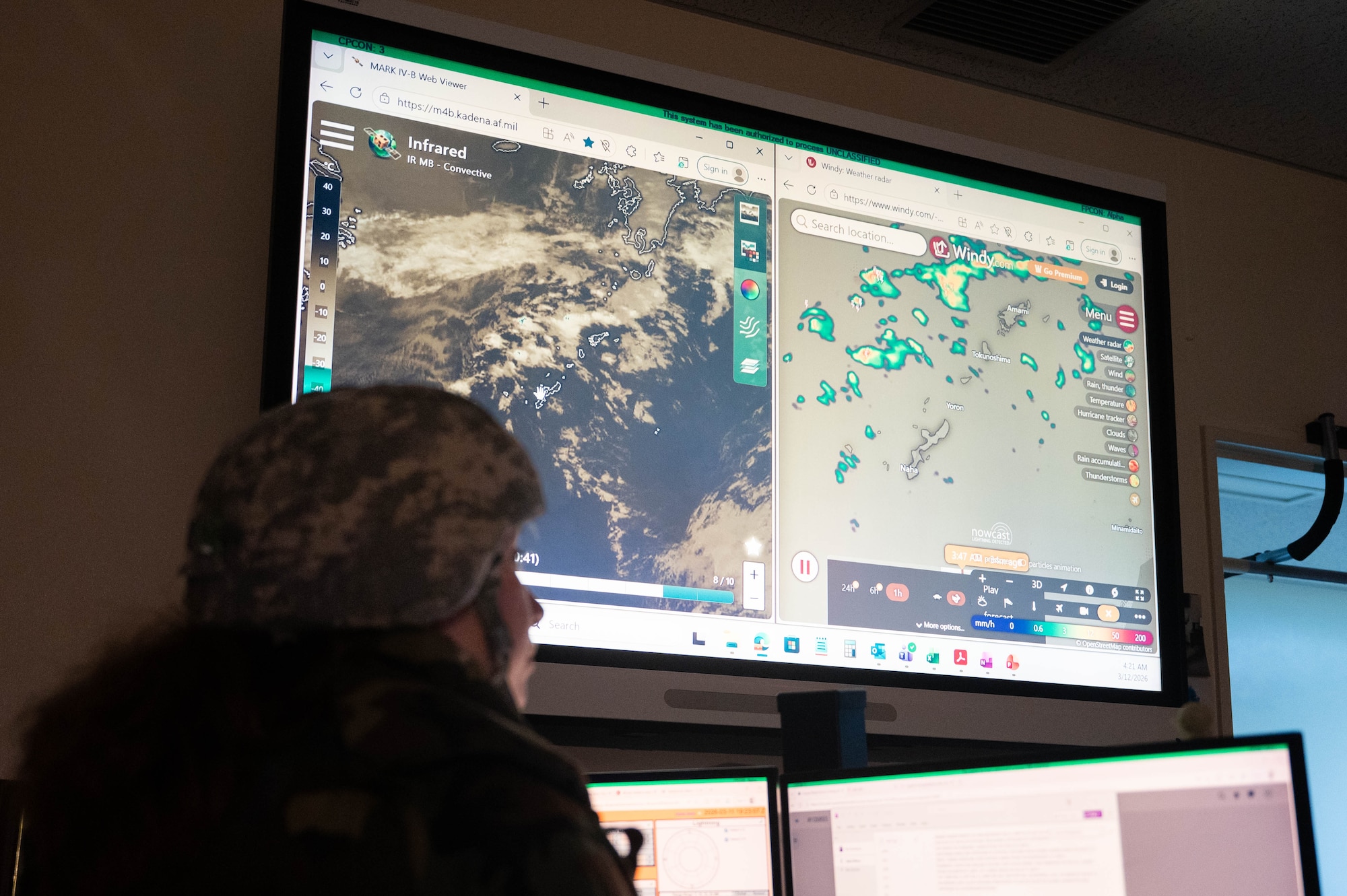 U.S. Air Force Senior Airman Vivian Ceniceros, 18th Operations Support Squadron weather forecaster, explains the weather forecast systems and maps during a USAF-led operational exercise Beverly Midnight 26 at Kadena Air Base, Japan, March 12, 2026. BM26 enhances resiliency and survivability across all levels by providing Airmen the opportunity to practice lifesaving skills, strengthening defense capabilities in support of regional security. (U.S. Air Force photo by Senior Airman Jamal J. Berry II)